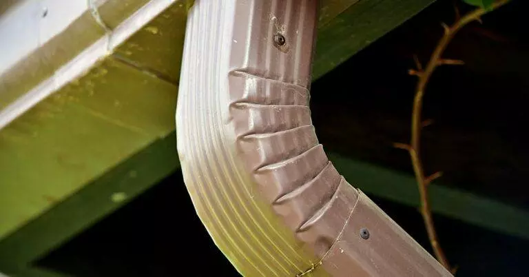 Understanding the Impact of Gutter Systems on Your Landscaping, Walkways, and Driveways